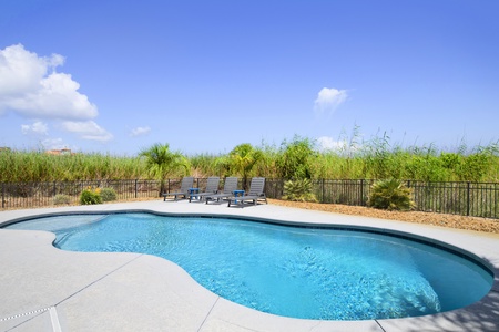 Private pool with chairs for tanning