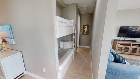 Bunk nook in hallway has twin over twin bunks