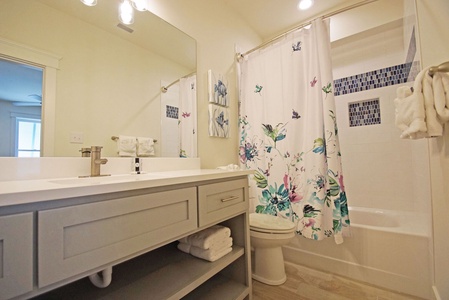 Private bath in Bedroom 8 with a tub/shower combo