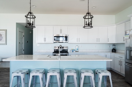 Kitchen has bar seating and lots of counter space