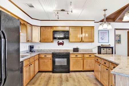 Large kitchen with granite countertops