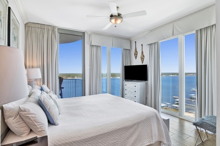 Bedroom 2 has a king bed, TV, Lagoon views, and a private bathroom