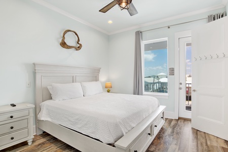 Bedroom 2 offers a King bed, TV, balcony access and private bathroom