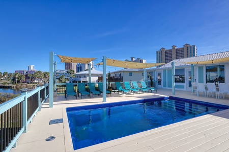 The private pool has plenty of seating and lounge chairs