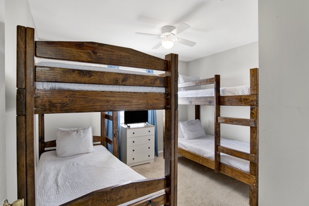 Bedroom 3 sleeps 4 guests in 2 twin bunk beds plus a TV