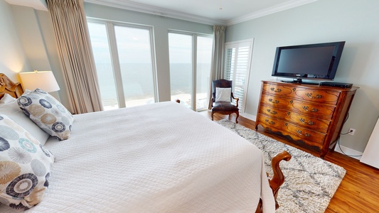 The master has amazing Gulf views, balcony access, TV and a private bathroom