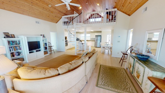 The spiral stairs lead up to the loft