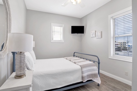 2nd floor Bedroom 4 has a queen bed and a TV