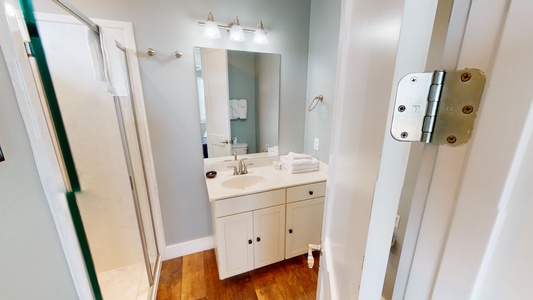 The private bathroom in Bedroom 6 has a walk-in shower
