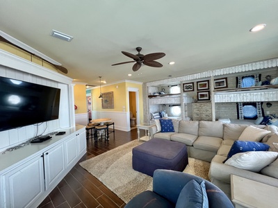 The 2nd living space offers ample space and has balcony access, sofa, TV, kitchenette and dining or card table
