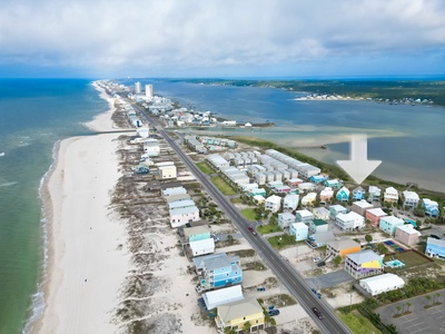 Birdseye view of West Beach Blvd, the Gulf of Mexico and Little Lagoon