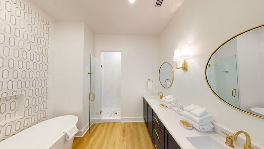 The master bath features a soaking tub, double vanity, walk in shower, and a water closet