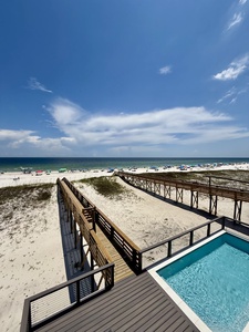 The large balcony on the 2nd floor is accessible from two bedrooms and the main living area