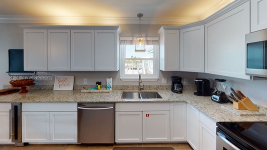 Updated kitchen with a large sink and plenty of counter space for meal prep