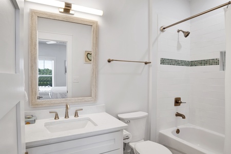 Summertime Blues II-The private bathroom for bedroom 5 has a tub/shower combo