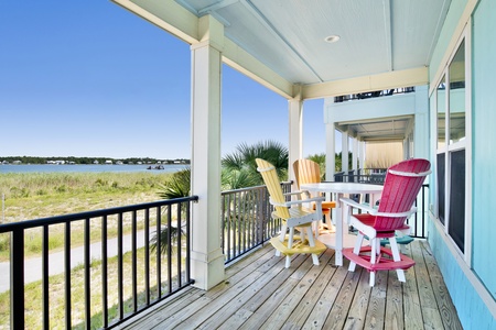 Enjoy the breeze and views on the covered balcony