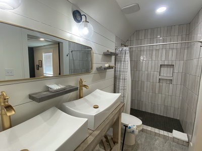 Master bath with double vanity and walk-in shower