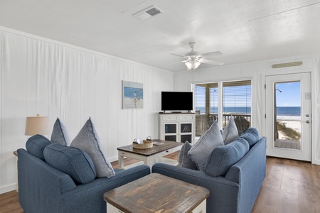 The living room offers a sleeper sofa, sleeps 2