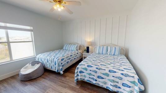 Located upstairs, bedroom 3 features two queen beds, sleeps 4 with TV with cable and attached, private bathroom