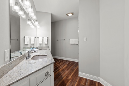 The private bath in Bedroom 4 has a double vanity and a walk-in shower