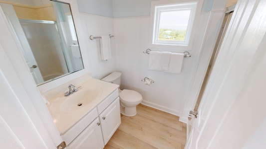 Little-Blue-Top floor bathroom with a tub/shower combo