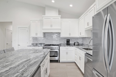 Beautiful granite countertops, tile backsplash and stainless appliances