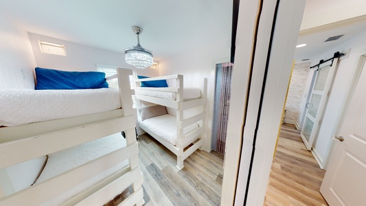 Bedroom 3 sleeps 4 in 2 Twin Bunk beds and has a mounted television