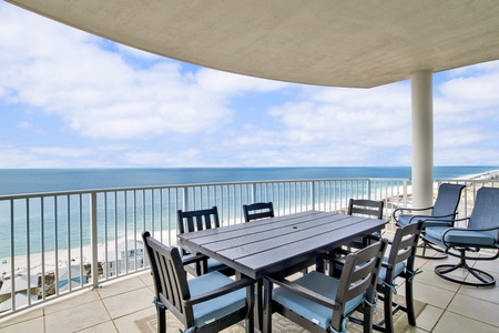 Gather around the table on the covered balcony with views of the Gulf