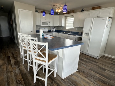 Open concept kitchen with island for extra seating