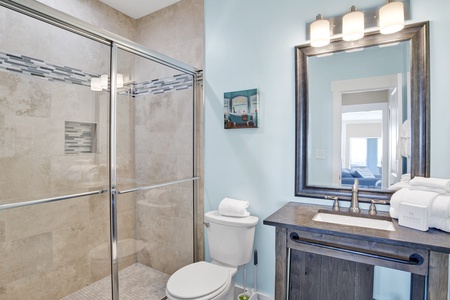 1st floor hall bathroom with a walk-in shower