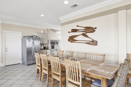 Spacious dining room with plenty of seating and an extra refrigerator