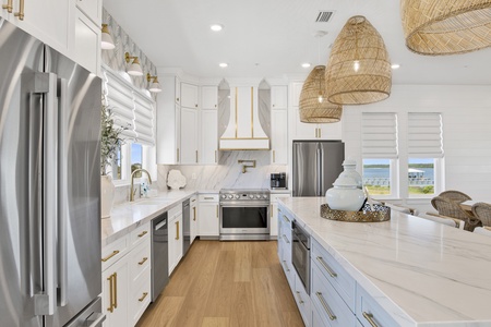 Gorgeous kitchen with stone counters and stainless appliances