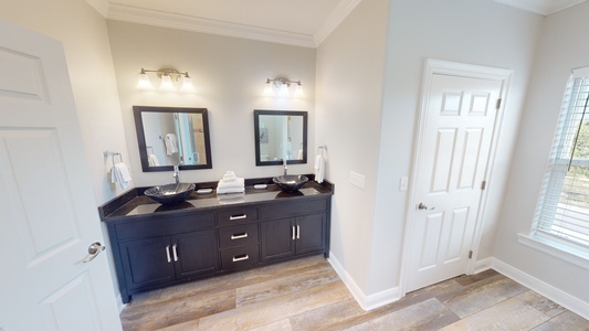 There is a double vanity in the 1st master bathroom