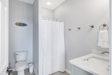 The private bath in Bedroom 6 has a walk-in shower