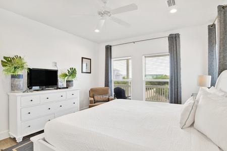 The master bedroom has a King bed and TV