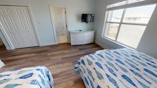 Located upstairs, bedroom 3 features two queen beds, sleeps 4 with TV with cable and attached, private bathroom