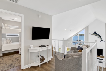 The upstairs loft offers a TV and sitting area