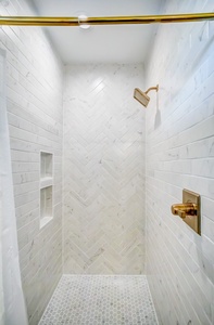 2nd floor SW bathroom 5 features a tile shower