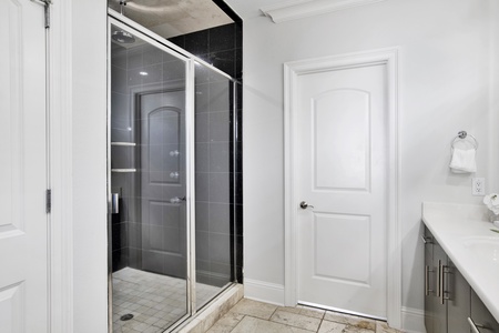 The bathroom in bedroom 7 has a large walk-in shower