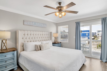 The primary bedroom offers balcony access and private, attached bathroom