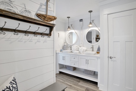 2nd floor bathroom with double vanities and large tiled shower