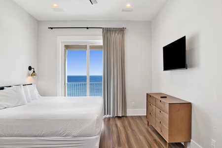 Bedroom #5 has balcony access, Gulf views and a TV