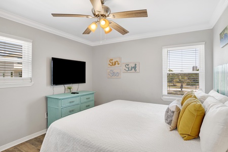 Guest bedroom 1 offers a queen bed and TV