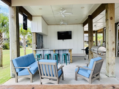 Awesome outdoor kitchen area plus a TV