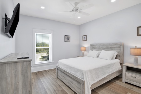 Summertime Blues I- Bedroom 5 on the 2nd floor with a queen bed, ceiling fan, TV and a private bathroom