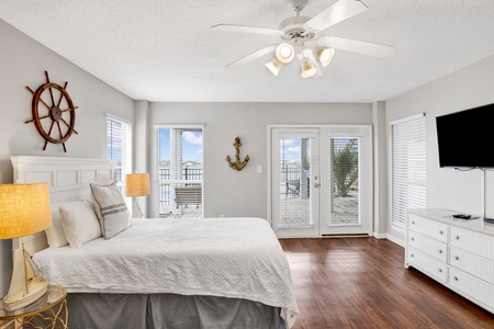 The downstairs studio has balcony access, private bathroom, kitchen, TV and a Queen bed, sleeps 2
