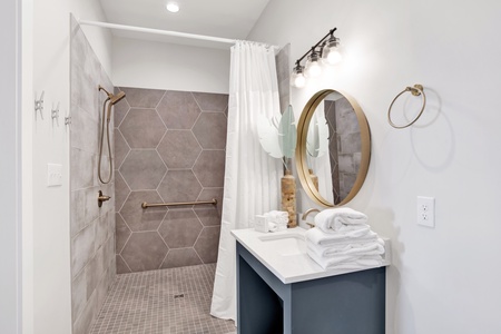Private bathroom for bedroom #3 with a roll-in shower