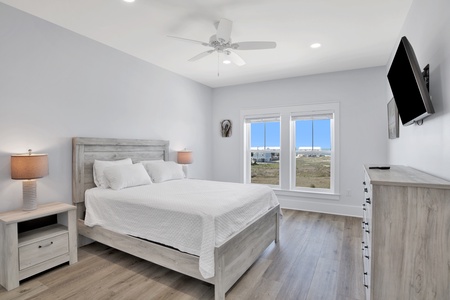 Bedroom 2 on the 2nd floor with a queen bed, Gulf views, ceiling fan, TV and a private bathroom