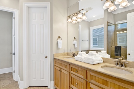 The private bathroom in bedroom 1 has a double vanity