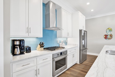 Gorgeous kitchen with stone counters and stainless appliances